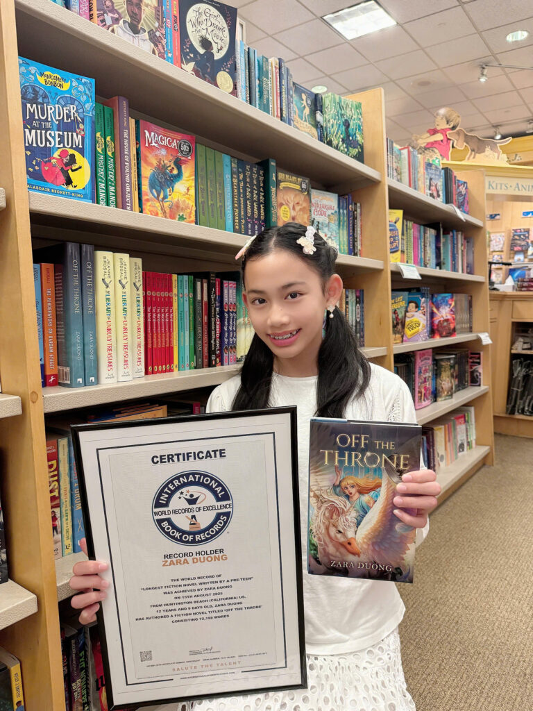 Author Zara Duong with the World Record of Excellence Certificate